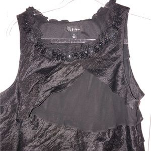 Pretty black dress with beads and ruffles on the neckline.